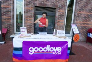 Chennelle Diong (MBA 2022) of GoodLove foods prepares gluten-free treats at the launch party.