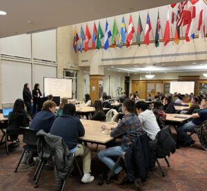 Students sit in Marcus Commons during a Management Club event.