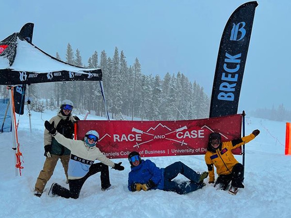 Students posed in front of a Race and Case sign in Breckenridge