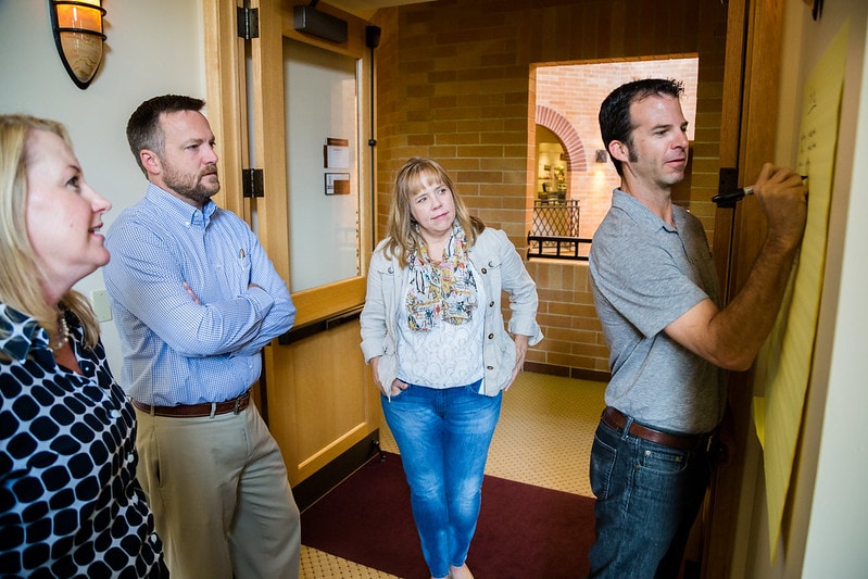 Four people discussing Insights