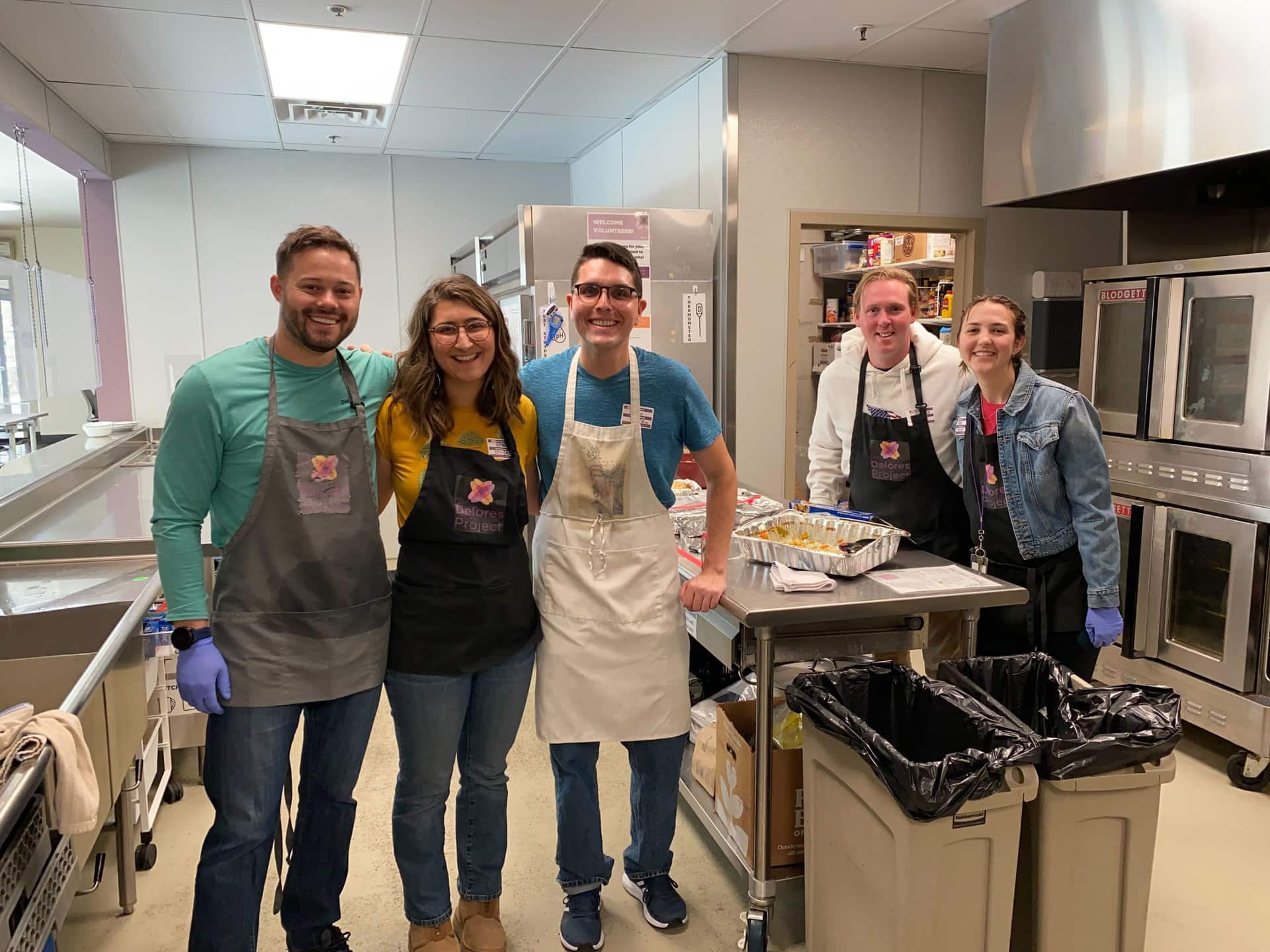 Students in aprons in a kitchen at the Delores Project.
