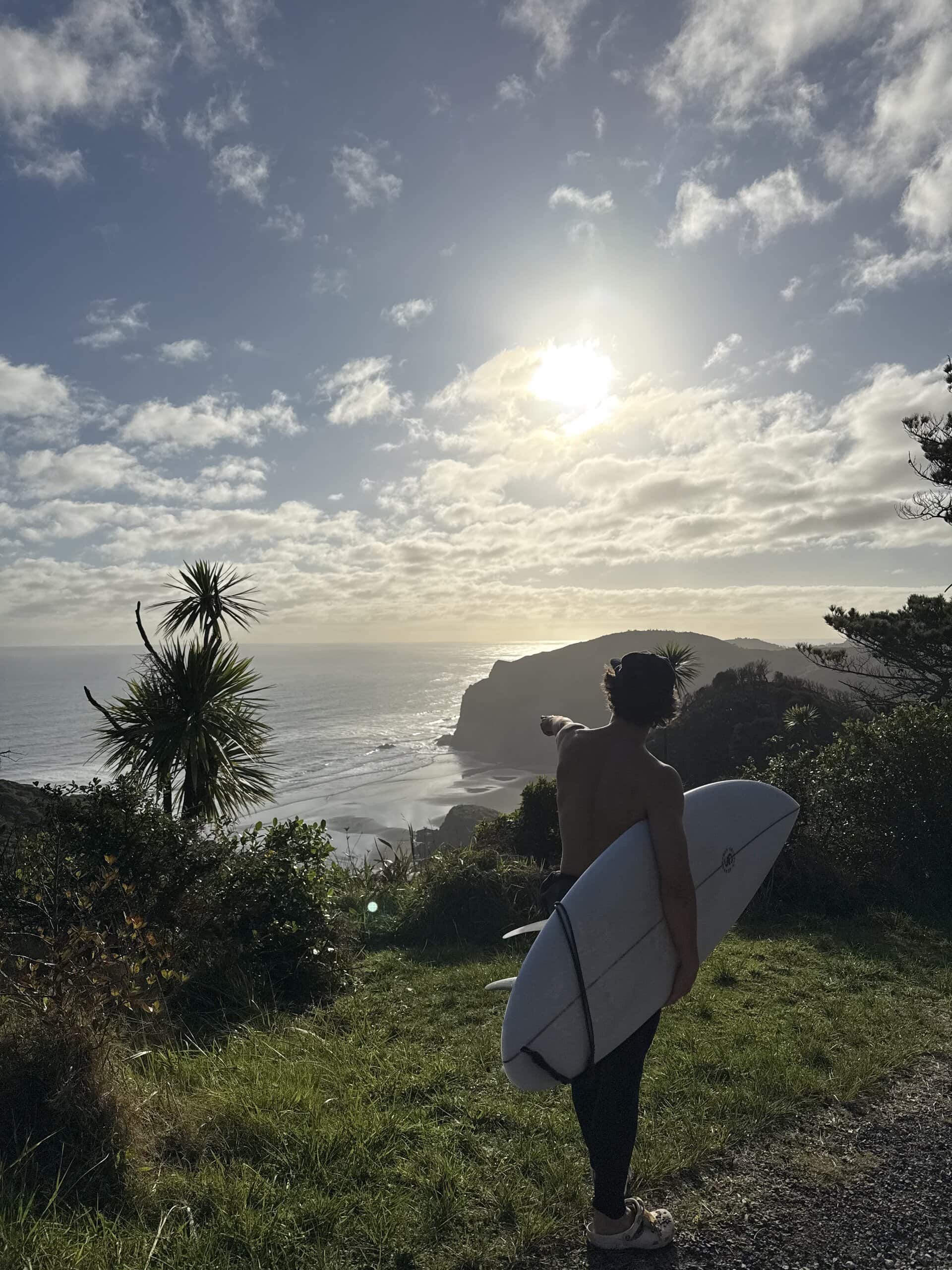 Andrew Bachrodt holding a surfboard