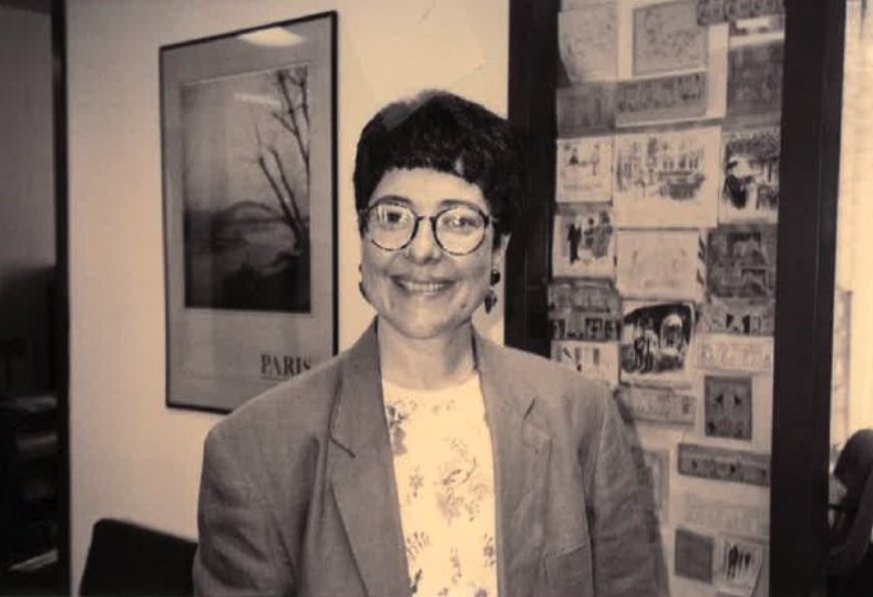 Cindi Fukami in a black and white photo in a classroom