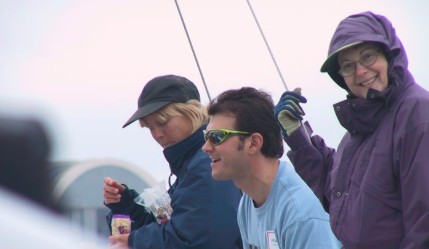 Fukami looking at the camera while wearing a jacket in a sailboat
