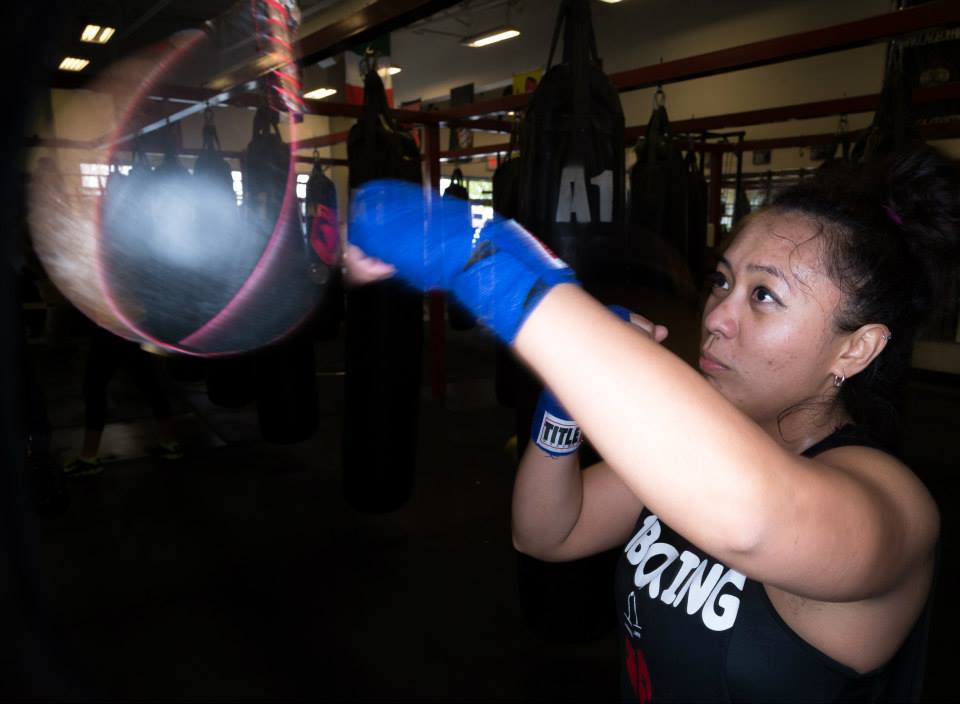 Joy Melgarejo punching a bag