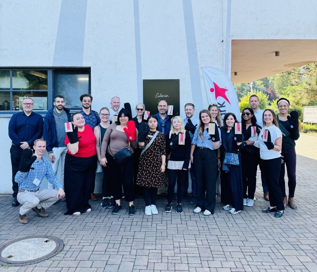 Students posing outside the Aramark building in Prague