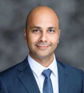 Yashar Atefi, PhD, faculty member in the Department of Business Information and Analytics at the Daniels College of Business, shown in a professional academic portrait.