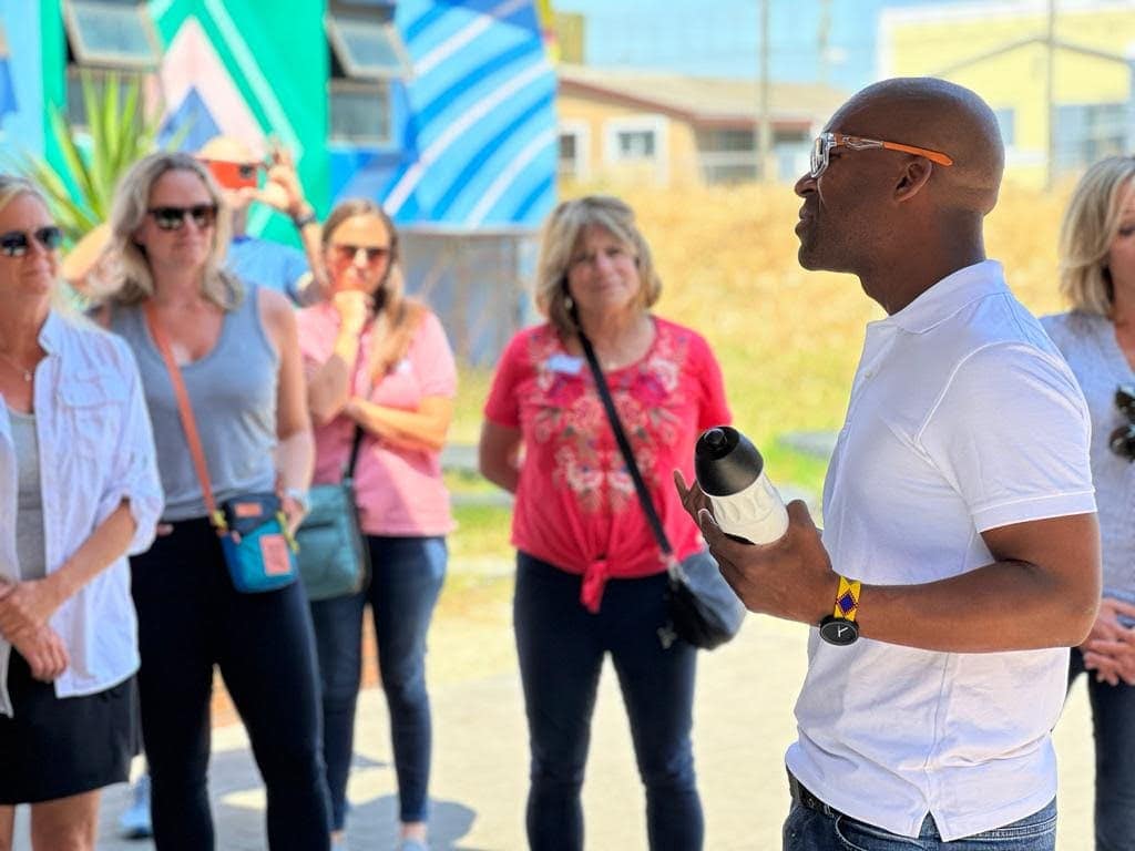 Man speaking to group of students in South Africa