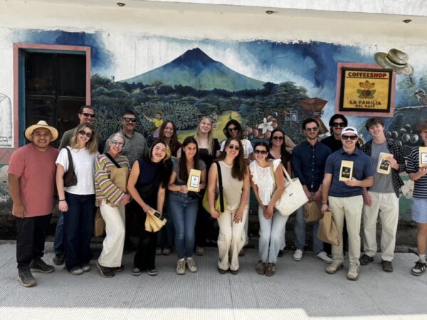 Daniels students posed in front of a Guatemalan business
