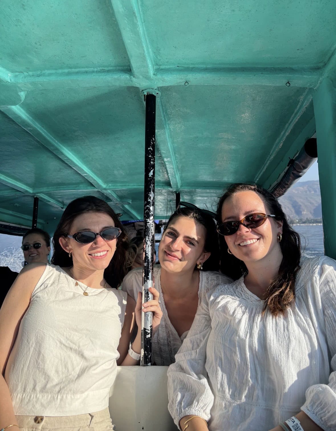 Three students on a bus in Guatemala